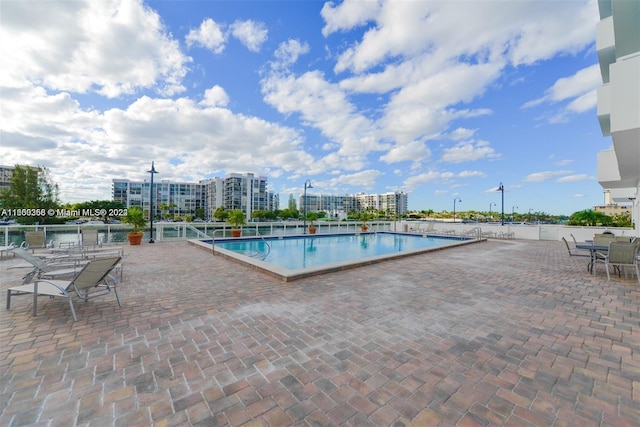 view of swimming pool featuring a patio area