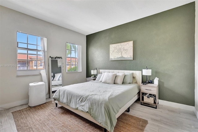 bedroom featuring light hardwood / wood-style floors