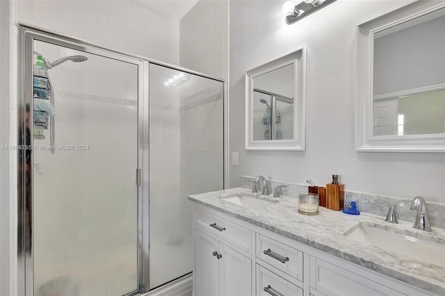 bathroom with an enclosed shower and vanity