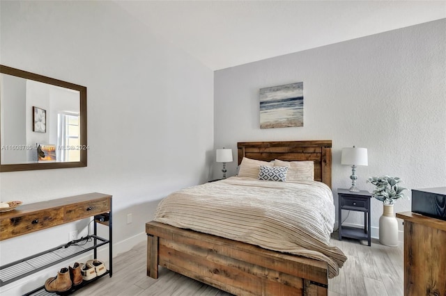 bedroom with light hardwood / wood-style floors