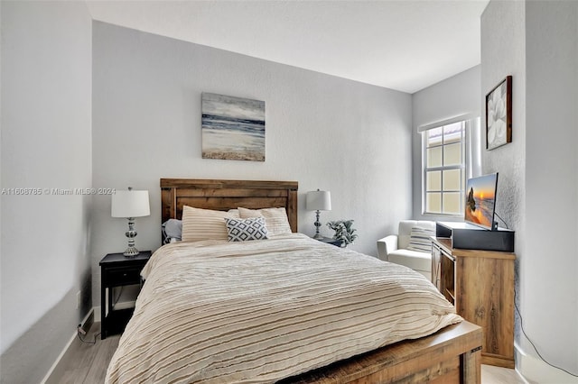 bedroom with light wood-type flooring