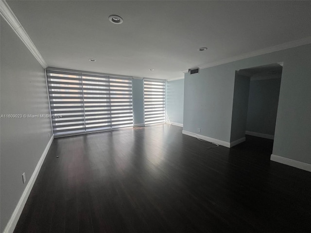 unfurnished room with crown molding and dark wood-type flooring