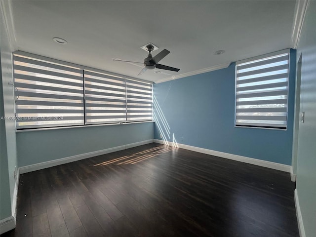 spare room with ceiling fan, dark wood-type flooring, and ornamental molding