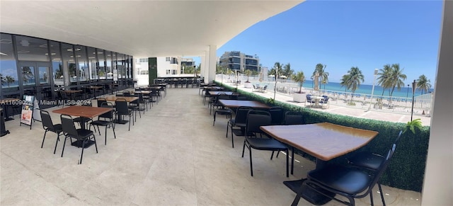 dining area with a beach view and a water view