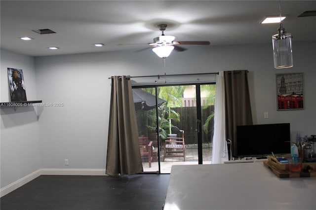 interior space with ceiling fan