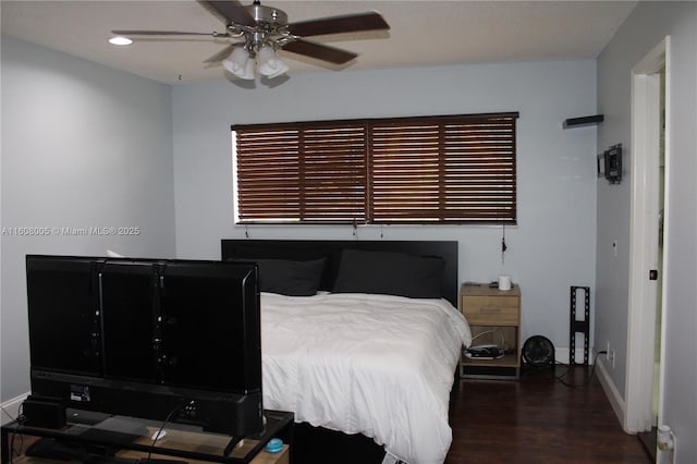 bedroom featuring dark hardwood / wood-style floors and ceiling fan