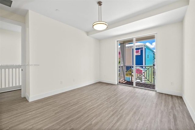 spare room with hardwood / wood-style floors