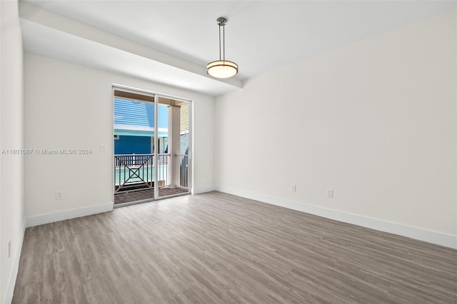 empty room with hardwood / wood-style floors