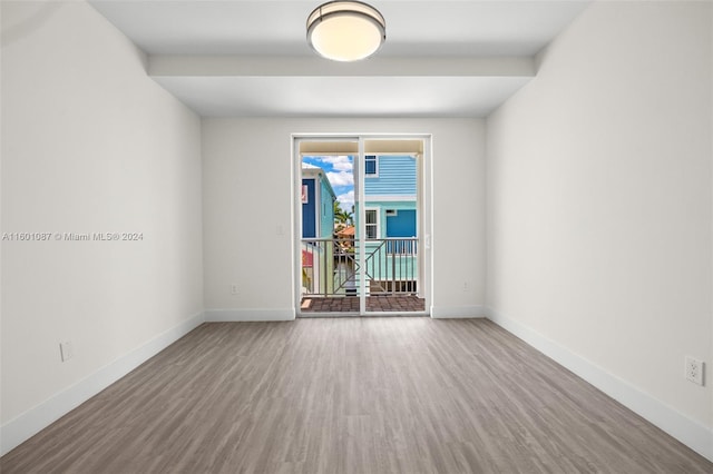 spare room featuring hardwood / wood-style floors