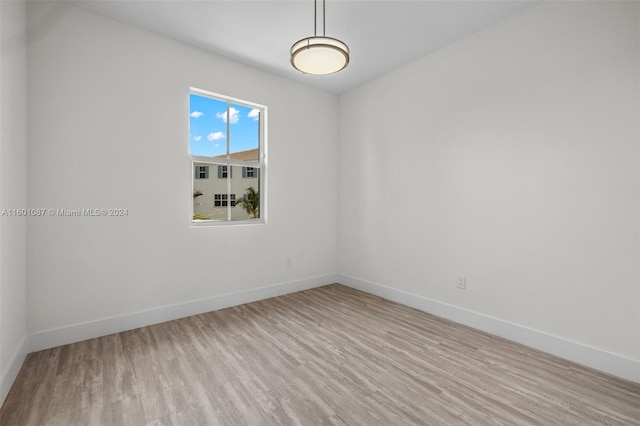 spare room featuring light hardwood / wood-style floors