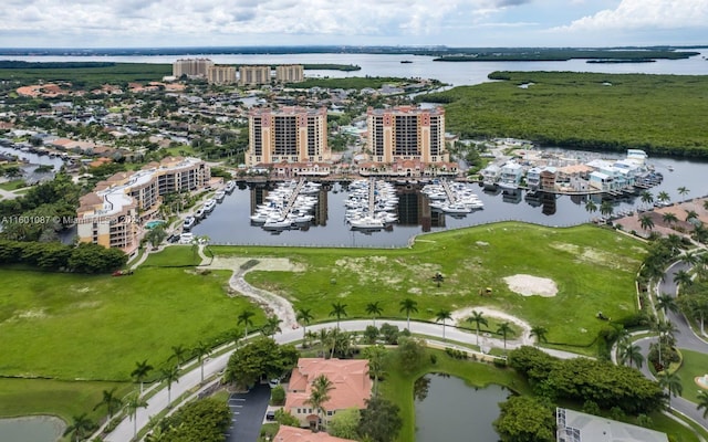 birds eye view of property with a water view