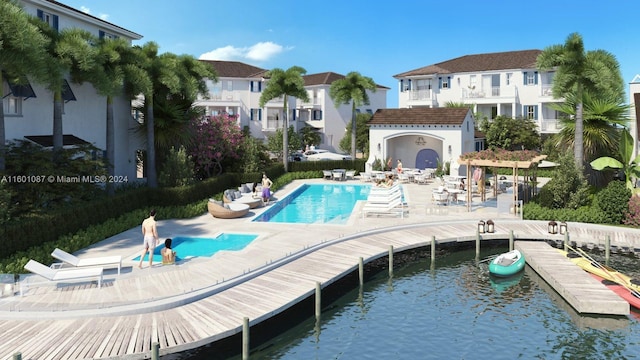 view of pool with a water view and a patio