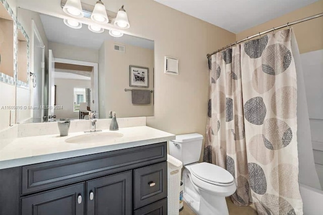 full bathroom featuring vanity, toilet, and shower / bathtub combination with curtain