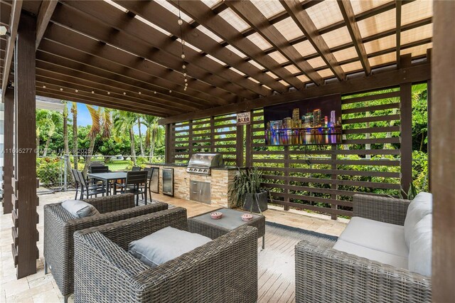 view of patio with area for grilling, a grill, outdoor lounge area, and a pergola