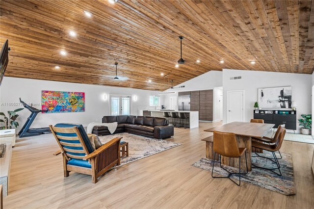 living room featuring lofted ceiling, wood ceiling, light hardwood / wood-style floors, and french doors