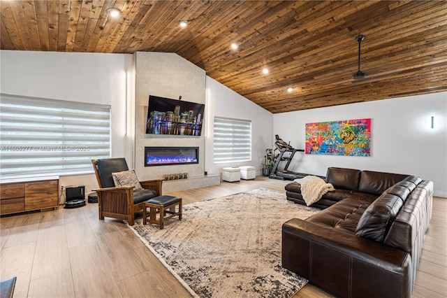 living room with hardwood / wood-style flooring, lofted ceiling, wood ceiling, and a fireplace