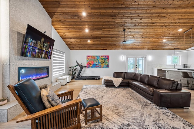 living room with sink, wood ceiling, high vaulted ceiling, and light wood-type flooring