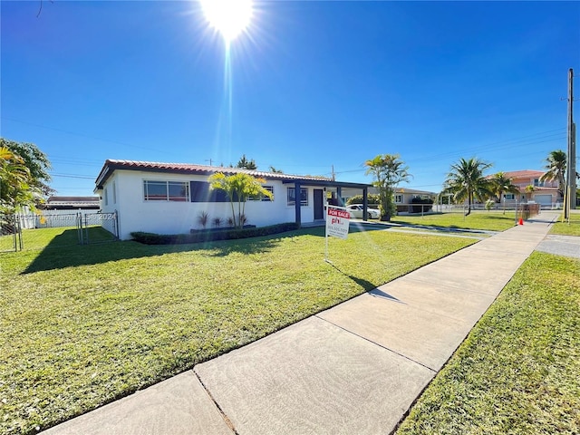 ranch-style home with a front yard