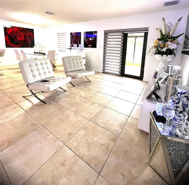 living room with light tile patterned floors