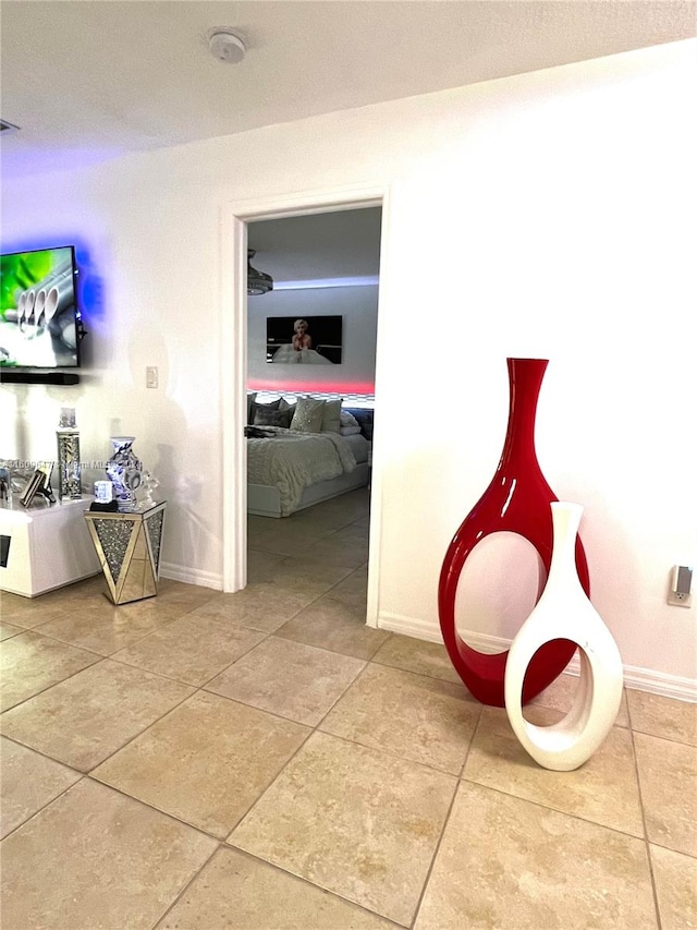 corridor with light tile patterned flooring