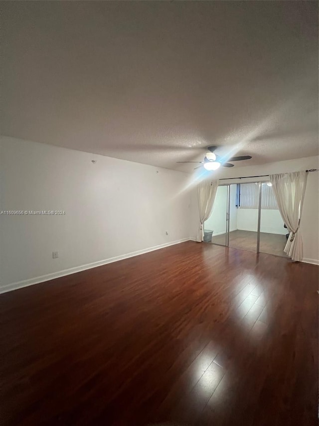 empty room with hardwood / wood-style floors