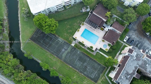 birds eye view of property featuring a water view