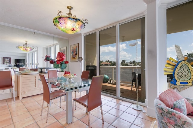 dining room featuring ornamental molding, floor to ceiling windows, and light tile patterned floors