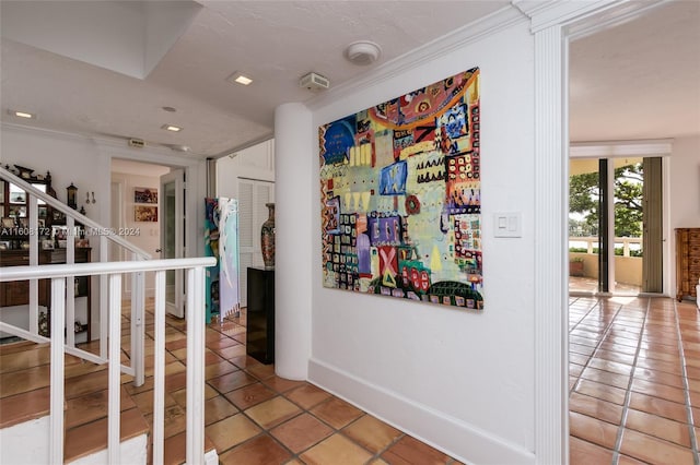 hall featuring tile patterned flooring and crown molding