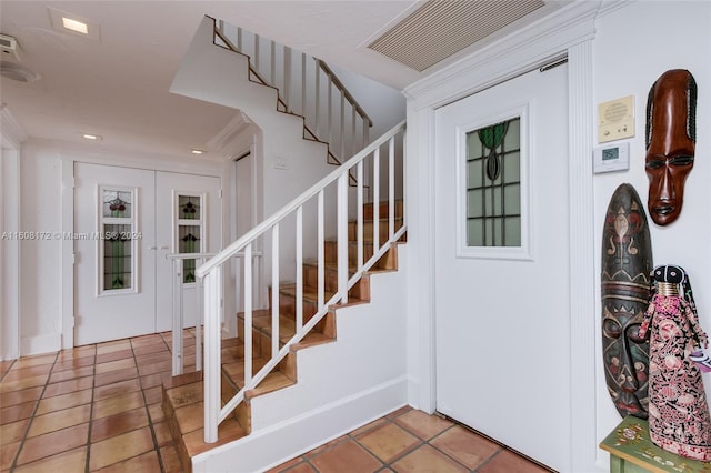 foyer with tile patterned floors