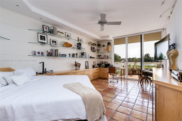 tiled bedroom featuring floor to ceiling windows and access to outside