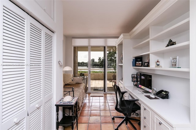 office featuring crown molding and built in desk