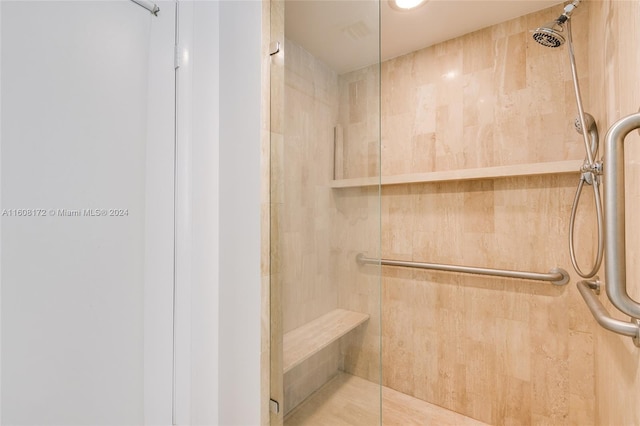 bathroom with a tile shower