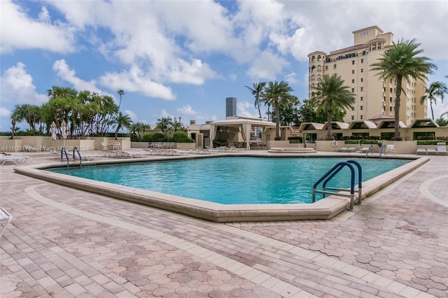 view of swimming pool with a patio