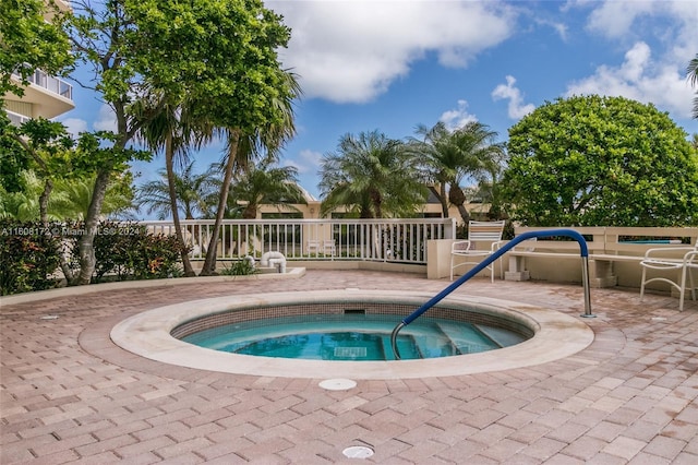 view of pool featuring a community hot tub