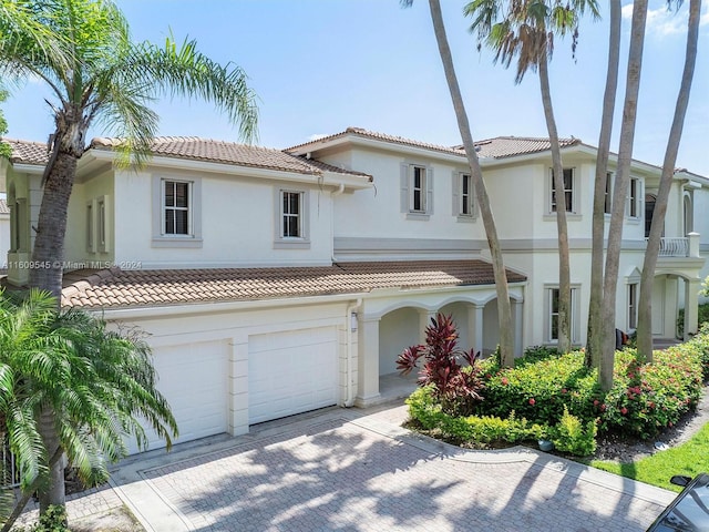 mediterranean / spanish-style house featuring a garage