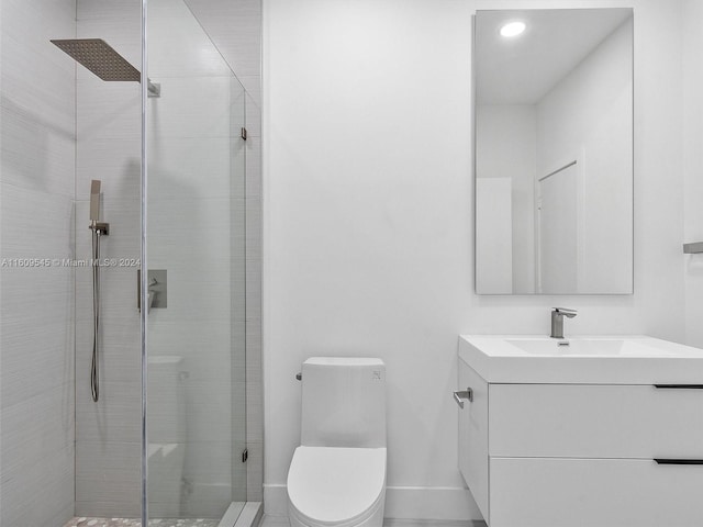 bathroom with a shower with door, large vanity, and toilet