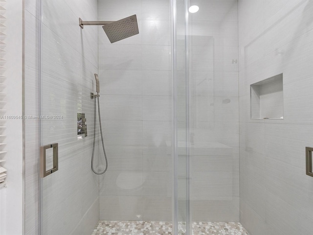 bathroom featuring an enclosed shower