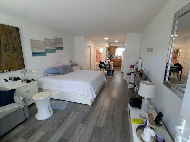 bedroom featuring a closet and dark hardwood / wood-style floors