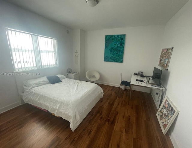 bedroom featuring dark wood-type flooring