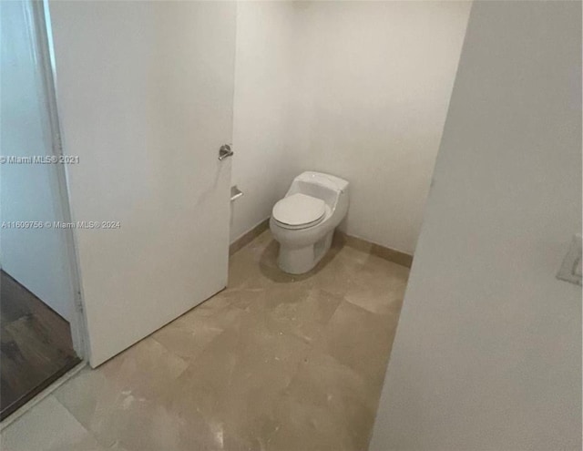 bathroom featuring toilet