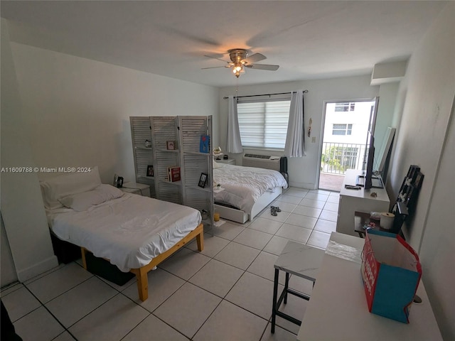 tiled bedroom with ceiling fan and access to outside