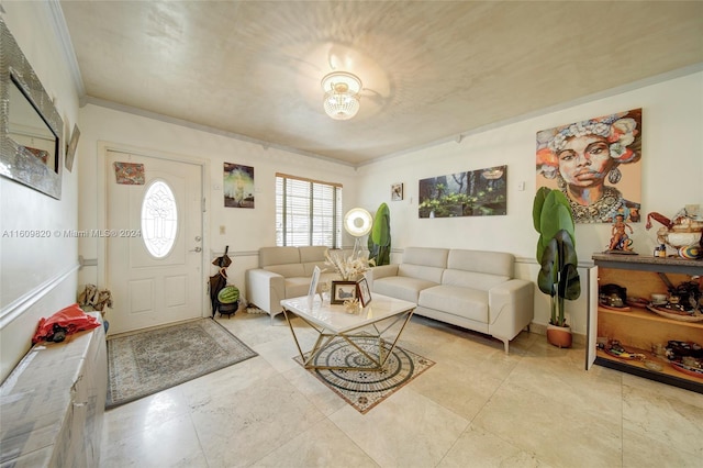 living room featuring ornamental molding and light tile flooring