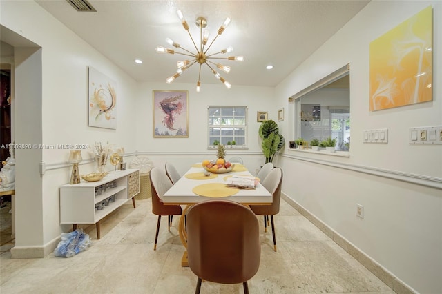 tiled dining space with a chandelier