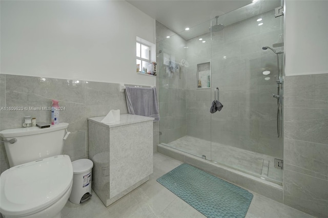 bathroom featuring walk in shower, tile walls, and toilet