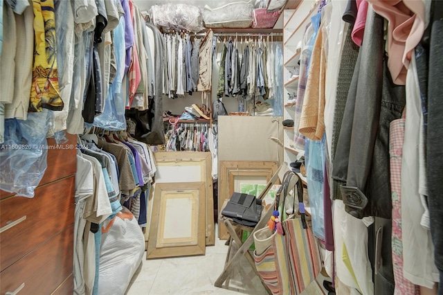 walk in closet featuring tile floors