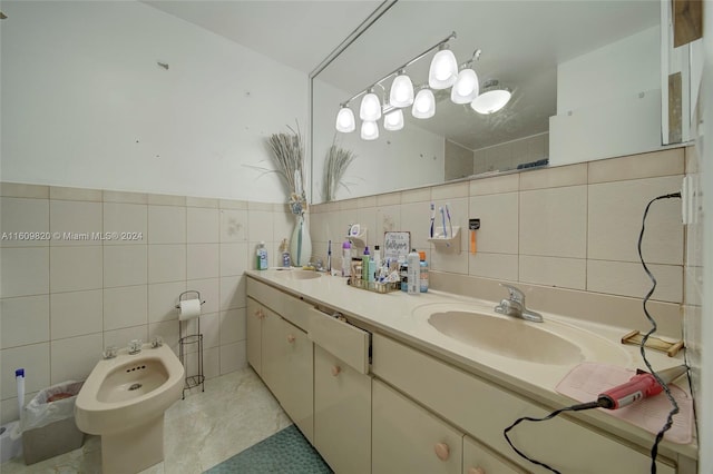 bathroom with a bidet, vanity with extensive cabinet space, tile walls, and tile floors