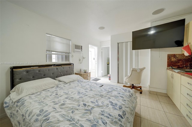 tiled bedroom with a wall mounted air conditioner