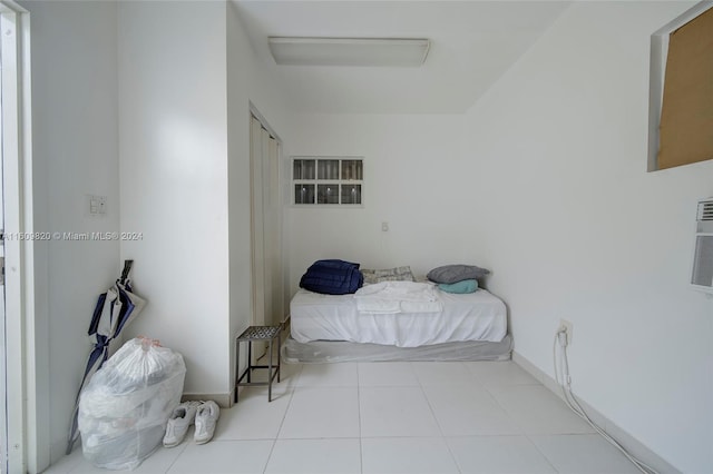 bedroom with light tile flooring