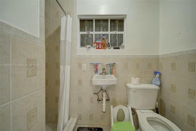 bathroom with tile walls, walk in shower, tasteful backsplash, and toilet