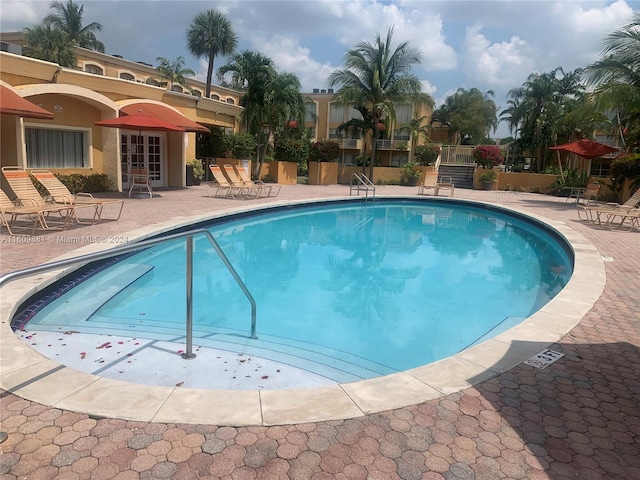 view of swimming pool with a patio area